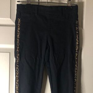 Girls black jeggings with leopard stripes and back pockets. Size 10-12.